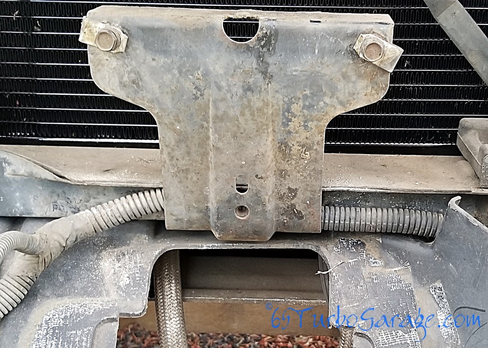 Loom behind oil cooler bracket